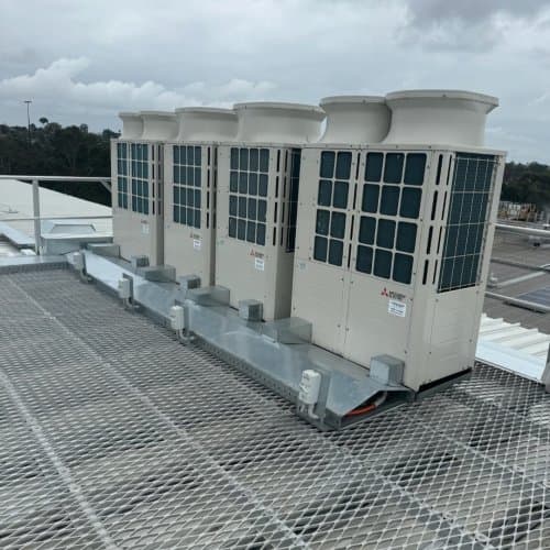 BES Air technician installing a split system air conditioner